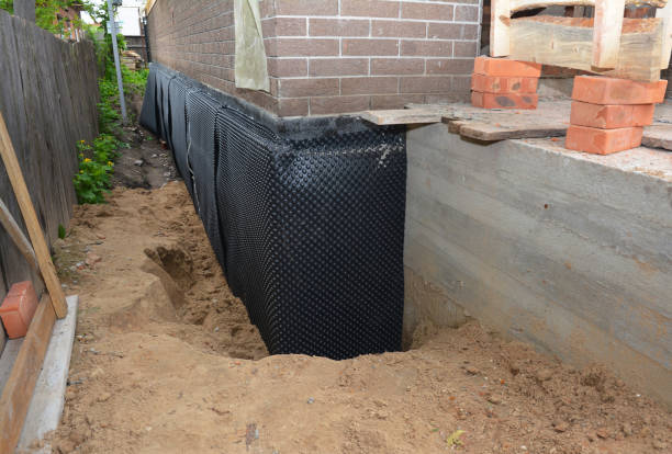 SJ Waterproofing Pros technician performing targeted Waterproofing assessment in Lyons, OH